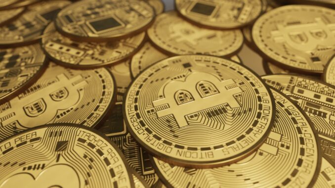 pile of Bitcoins on a table